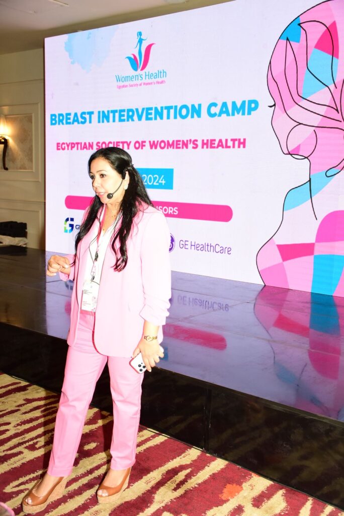 "Dr. Norran Hussein speaking at the Breast Intervention Camp organized by the Egyptian Society of Women’s Health, highlighting expertise in breast imaging and intervention in Dubai."