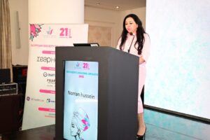 Dr. Norran Hussein speaking at the Women’s Imaging Update 2025 conference, presenting on breast imaging and women’s health